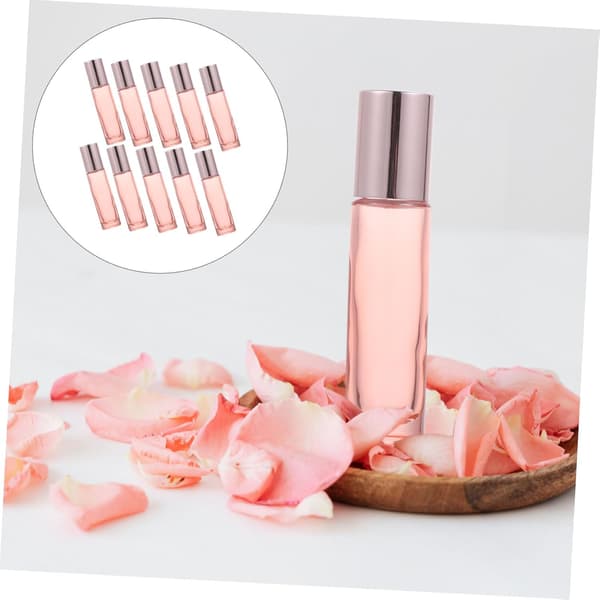 10 st 10 ml rosa glasflaskor för eteriska oljor med rullar i rostfritt stål och ABS-lock
