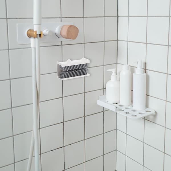 Silikone hårfanger til bruser med lågdesign og vægmonteret struktur