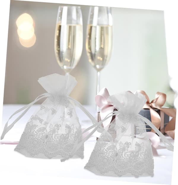 8 stk. elegante smykkeposer med snøring i blonde og brodert netting