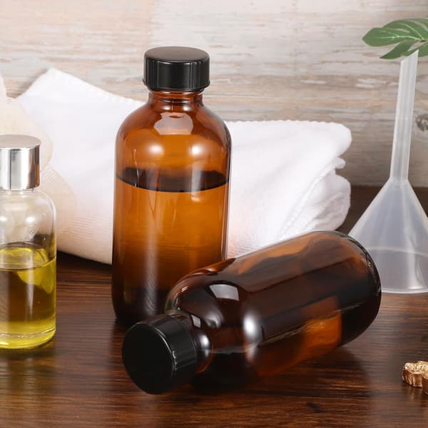 Bärnstensfärgade runda glasflaskor 120 ml med bakelitlock 4 st för eteriska oljor och resedispensrar