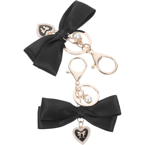 2 stk. Nøglekæder med sløjfevedhæng, armbånd, håndledsremme, nøgleholder