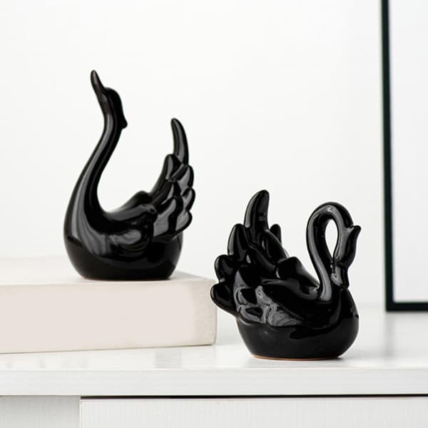 2 stk. keramiske svane-figurer, lette og pladsbesparende, svaneformede dekorative