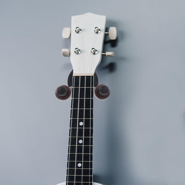 Utrymmesbesparande gitarrhängare väggfäste för musikinstrument och gitarrer
