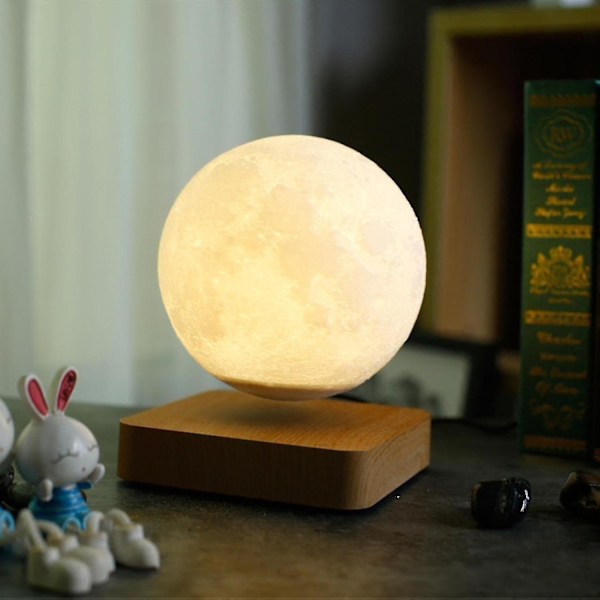 Levitating Moon Lamp Flyter og spinner fritt i luften med luksuriøs trebase og 3D-utskrift LED