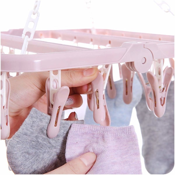 32 hopfällbara sockhängare med klämmor, roterande krok (rosa)