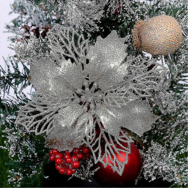 Julepynt Juleblomster dekorerer juletræer, julekranse, gaveæsker og indendørs og udendørs pynt.