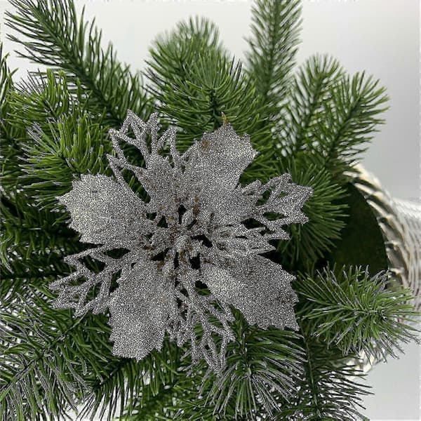Julepynt Juleblomster dekorerer juletræer, julekranse, gaveæsker og indendørs og udendørs pynt.