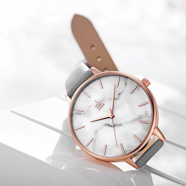 Minimalistisk dameklokke ultra-flat elegant