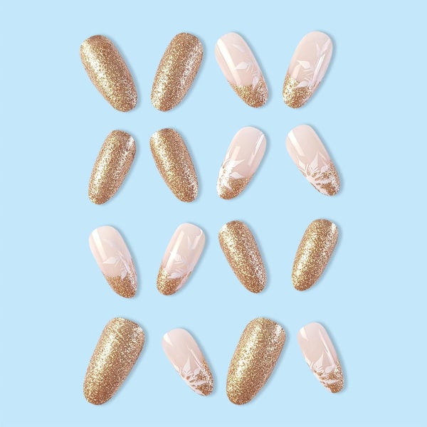 Falska naglar medel längd, mandel press on naglar guld glitter glänsande falska naglar med vit snö design, akryl stick on naglar för kvinnor