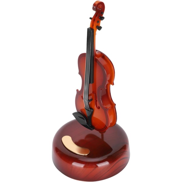1 stycke speldosa, i form av en cello, med en roterande