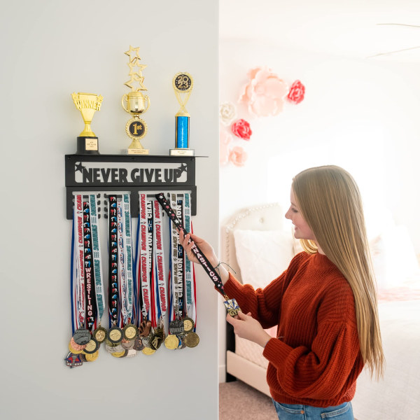 The wall metal prize rack can hold 64+ sports MEDALS