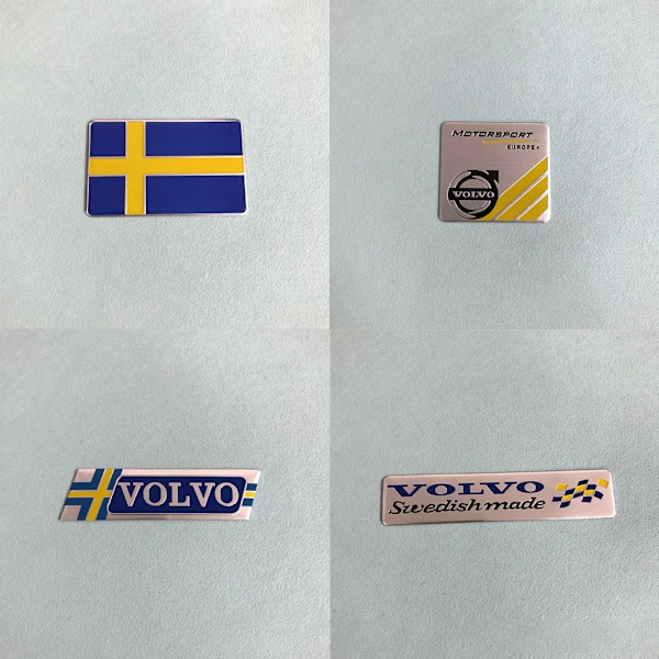 (Firkant svensk flagg + firkant Volvo-logo + VOLVO parallellogram +