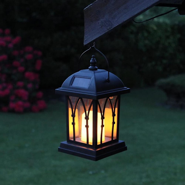 Svart solcellslykta med LED-ljus och bedrägligt realistisk