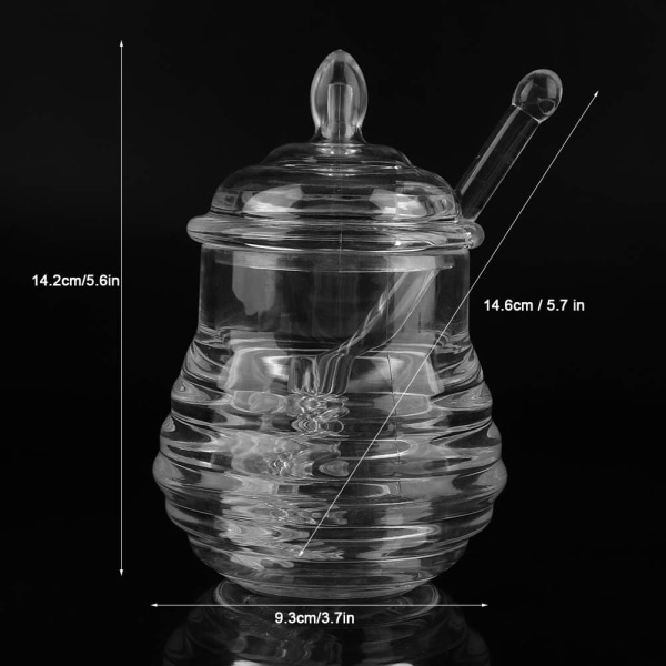 Honningkrukke med ske og låg i glas, varmebestandigt glas