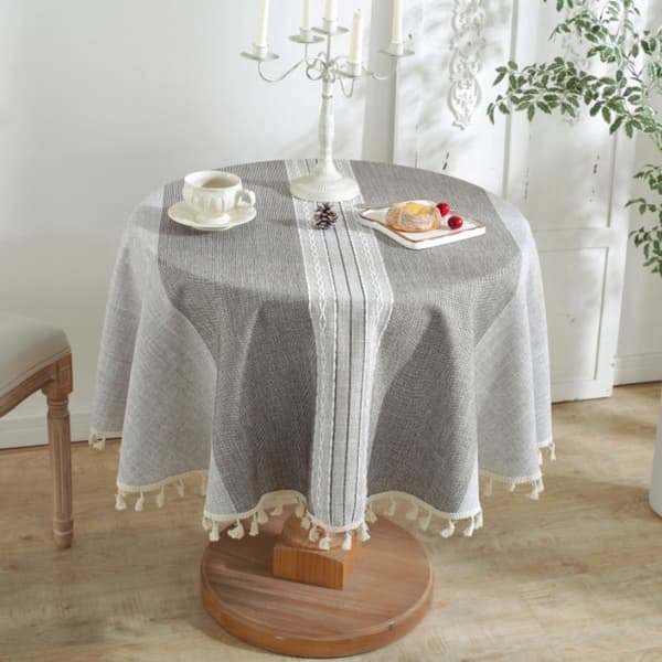 Rund bordsduk i polyester med tofsar, maskintvättbar, 140 cm, grå