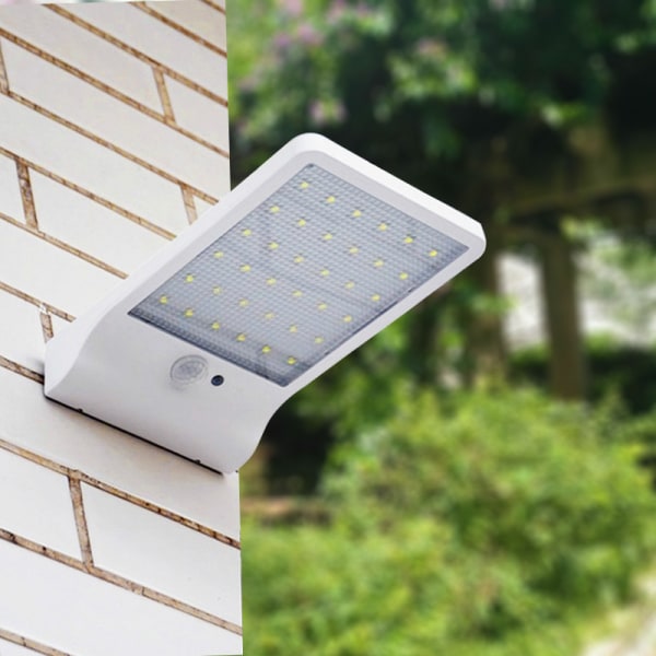 White Solar Light Outdoor 48 LED Motion Sensor Light Dimbar med trådløs fjernkontroll Vanntett solcellelampe for døråpning Corri