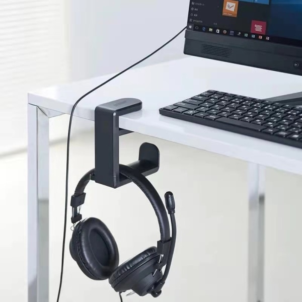 PC-pelikuulokkeet kuulokkeiden koukkupidikkeen ripustuskiinnike, kuulokejalusta säädettävällä ja pyörivällä varren kiinnikkeellä, pöydän alla