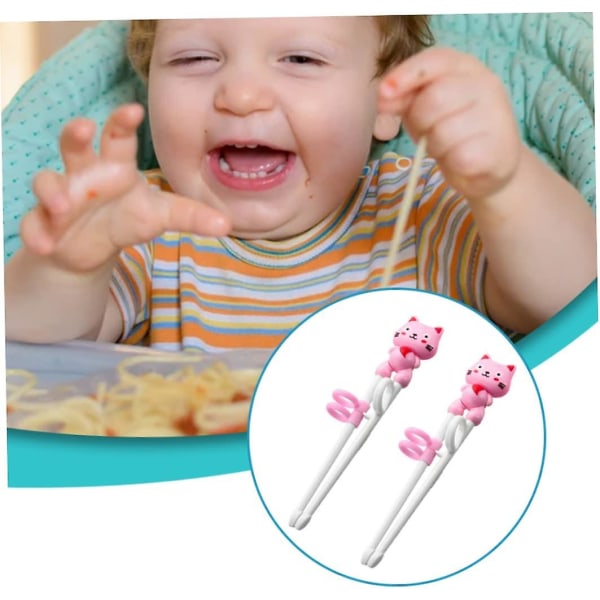 Lasten harjoitussyömäpuikot Söpöt sarjakuva-oppimissyömäpuikot rengashihoilla baby ruokailuvälineille (1 setti, vaaleanpunainen)