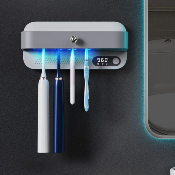 UV-hammasharjan desinfiointituulettimen lämmitys- ja kuivaustoiminto Seinälle kiinnitettävä sterilointiainepidike, joka sopii suun hammasharjoille