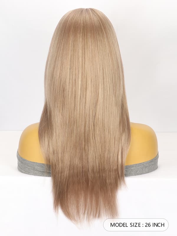 Light brown long straight hair with bangs and multiple layers