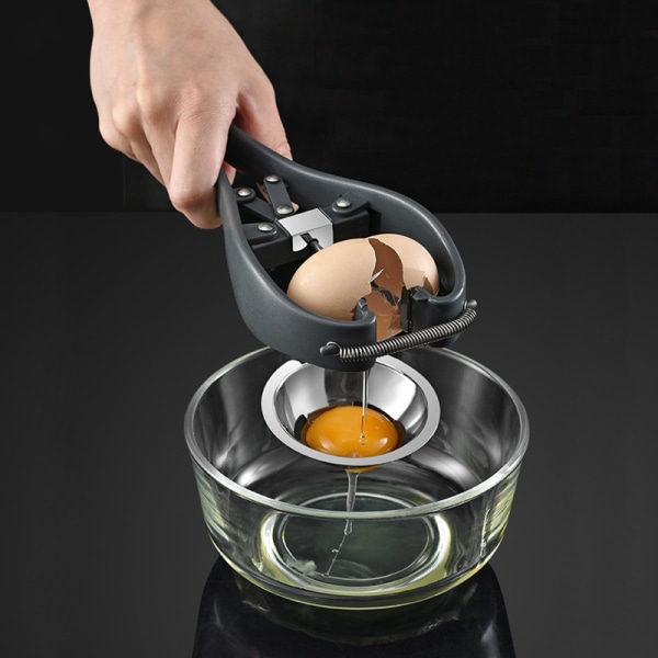 Äggseparator i rostfritt stål Automatisk äggknäckare för rå äggvitseparator Handhållen äggöppnare Enkel äggskalsskärare Creative Kitchen Gadge