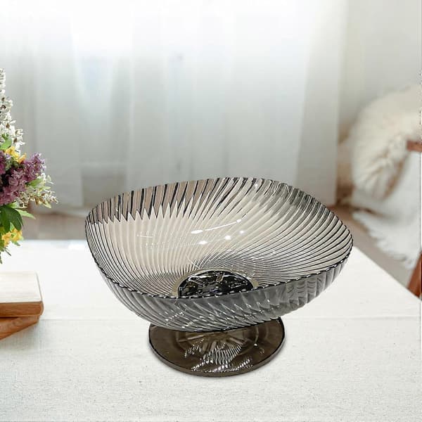Black fruit bowl with pedestal and drain, large kitchen colander and table decoration
