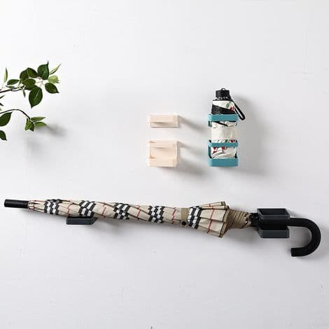 Creative wall-mounted umbrella holder with shelf and drying rack