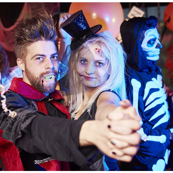 10 stycken glödande Halloween vampyrtänder