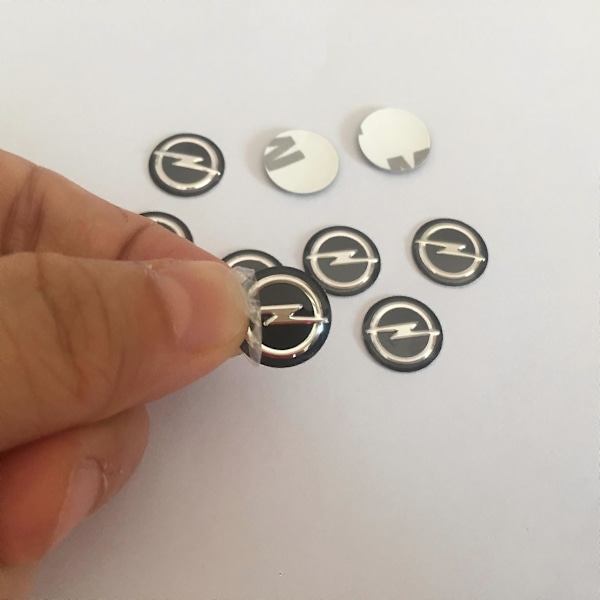 Opel Astra Mokka Insignia Zafira Corsa Tigra Auton Avaimen Kaukosäätimen Embleemi Tarra Vaihto (10 kpl, 14 mm)
