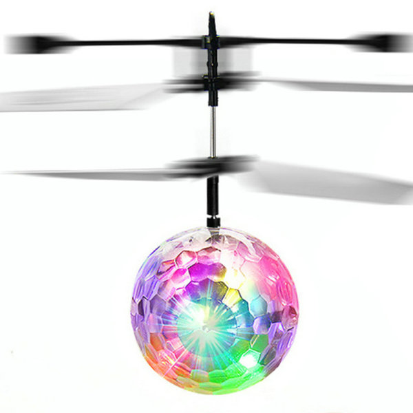 Fargerik krystallkule flysensor lysende flytende helikopter