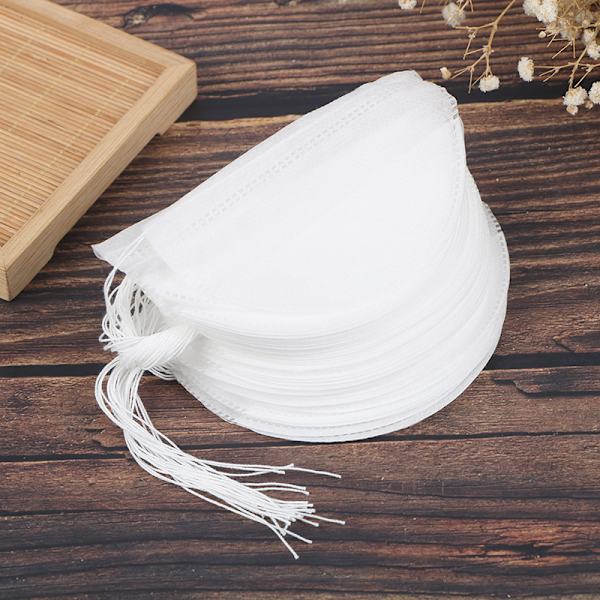 50 kpl Tyhjiä teepusseja sisältävä infusori String Heal Seal Filte -suodattimella