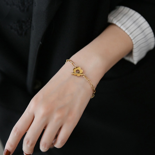 1 st modelegering ihålig blomma stålkula OT spänne armband