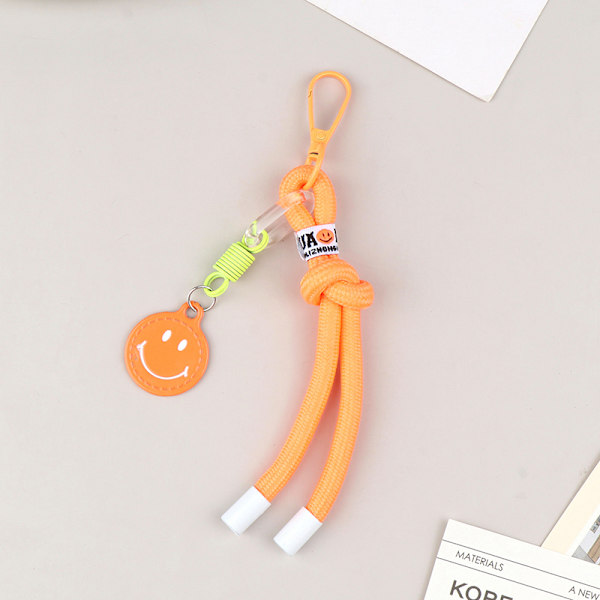 Värillinen punottu avaimenperä Smiley riipus avaimenperä reppukorut Orange