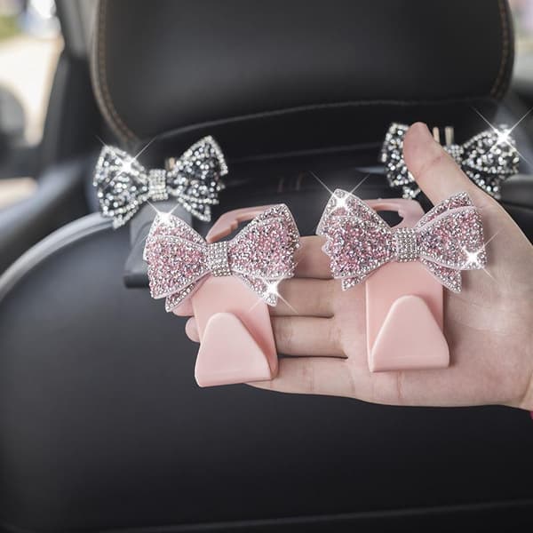 Bil nakkestøttekroker med glitrende rhinestone sløyfedekor og solid D