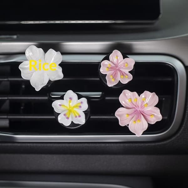 2 stk. bilblomsterformede parfumeclips til klimaanlæggets udluftning White