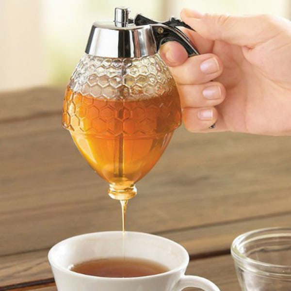 The honey dispenser does not leak, imitating a glass cup, with a stain