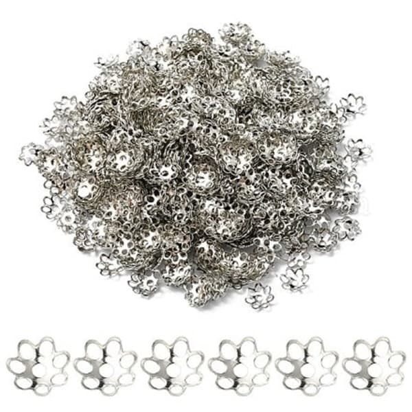 Litt over 200 nikkelfrie platinaplaterte perlehetter Ø 6 mm.
