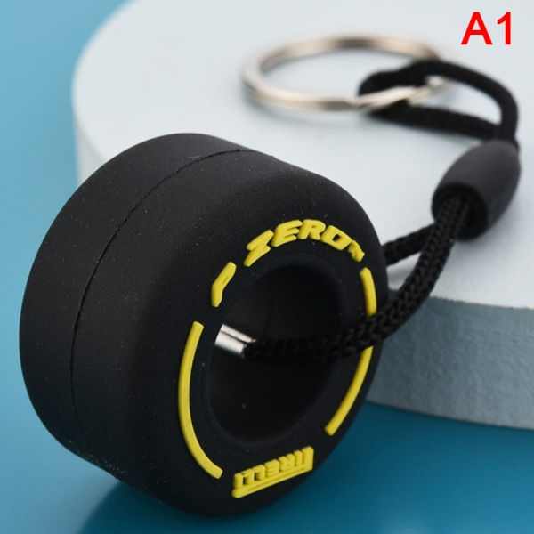Auton renkaiden avaimenperä Autourheilun vanteiden avaimenperä Auton muotoilu Yellow