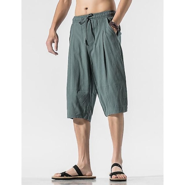Miesten joogashortsit kiristysnyörillä tasku Capri-housut Alaosat Nopeasti kuivuvat kosteutta siirtävät kevyet yksiväriset muotishortsit Gray Green XL