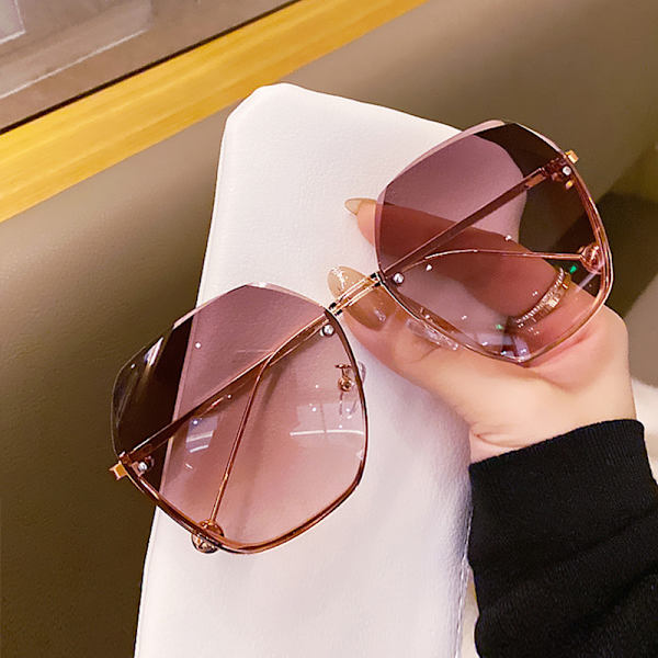 Kantlösa solglasögon i metall med dekorativa glas, rosa