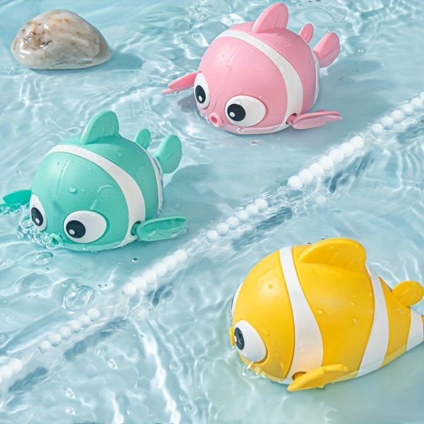 Lasten kylpy leluvauva leikkii vesipellekalaa Pink