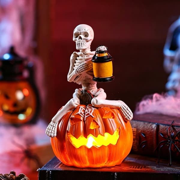 Halloweenpynt indendørs, harpiksskeletter på græskar med Jacks O Lantern-lys