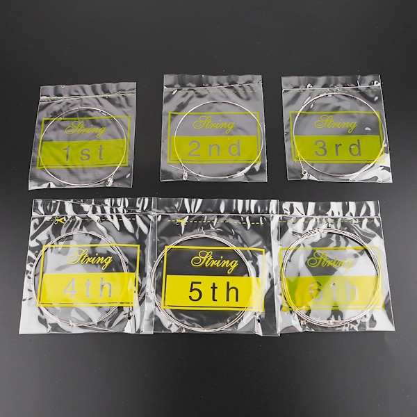 6 st/förpackning Universal Elektrisk Gitarr Sträng Mässing Hexagonal Stål Kärna Strängar