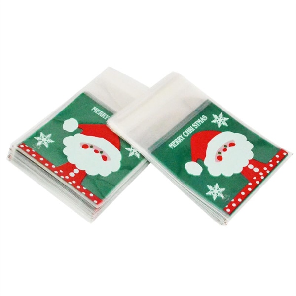 50/100 st Kakpresentpåsar Jul Tomte Snögubbe Snacks Kaka Plastförpackningspåsar Fest Bröllop Godispåse Barn Favorit Santa Claus 50pcs