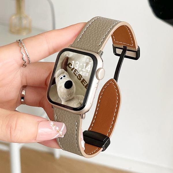 Klockarmband för Apple Watch iWatch för Serie 10 42mm Lycheemönster magnetisk sug - elefantgrå