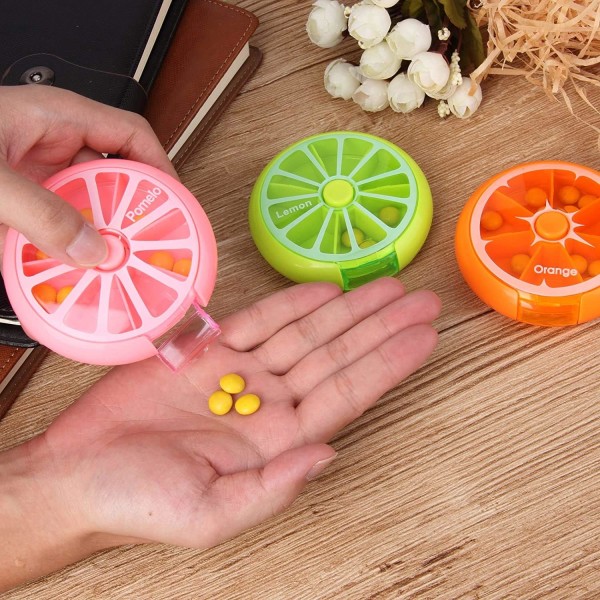 Creative Portable Mini 7-dagers ukentlig sirkulær form Roterende søt fruktstil pilleoppbevaringsboks (flerfarget)