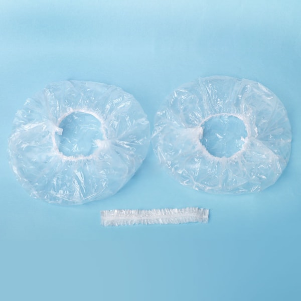 100-pack klara elastiska engångsduschmössor i plast för badrum