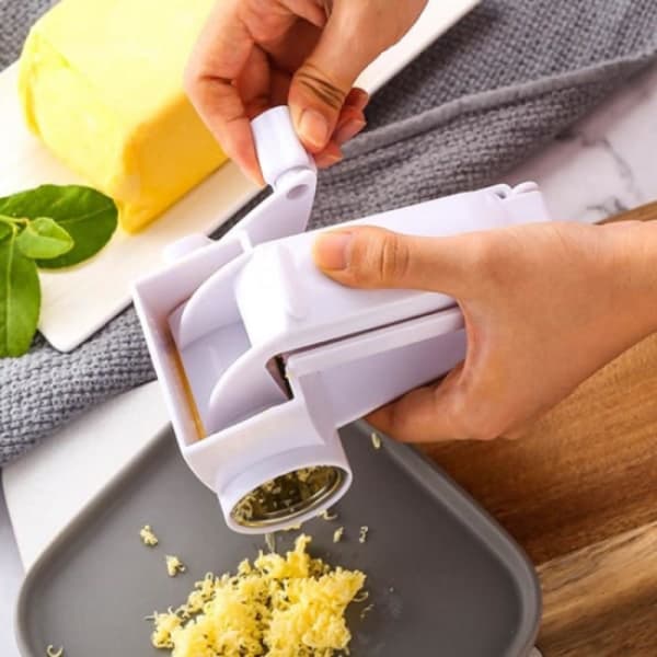 Handroterande ostkvarn med rostfria fat