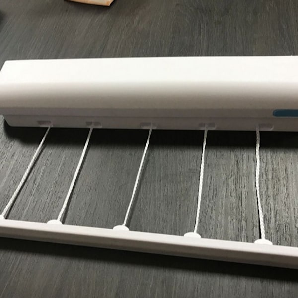 Automatisk infällbar klädstreck Fem trådar Fjäderbelastade kläder