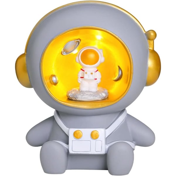 Söpö sarjakuva astronautti yövalokoristefiguuri säästöpossutoiminnolla (harmaa)